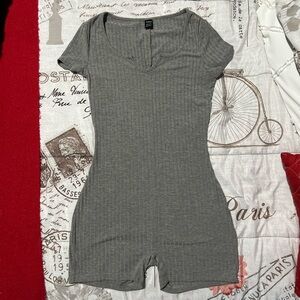 Never worn, grey one piece fits like a medium, but it’s a Xs